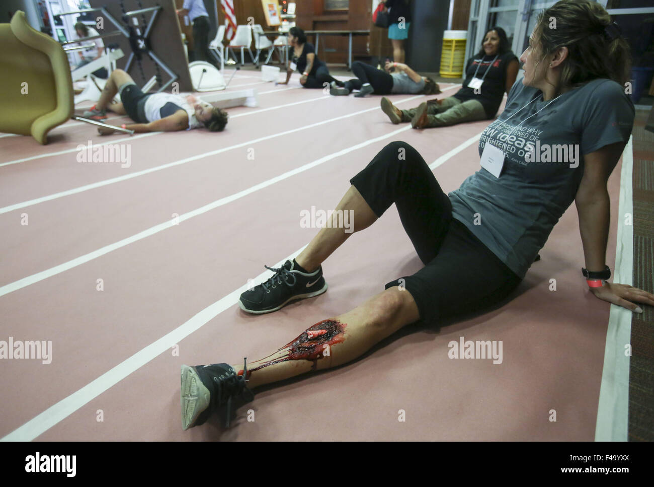 Los Angeles, California, USA. 15th Oct, 2015. A mock victim waits for rescue during the annual Great California ShakeOut earthquake drill at Southern California University (USC) in Los Angeles on October 15, 2015. About 10.4 million Californian's registered to take part in the annual drill that asks participants to 'drop'' to the ground, take 'cover'' under a desk, table or other sturdy surface, and 'hold on'' for 60 seconds, as if a major earthquake were occurring. Credit:  Ringo Chiu/ZUMA Wire/Alamy Live News Stock Photo