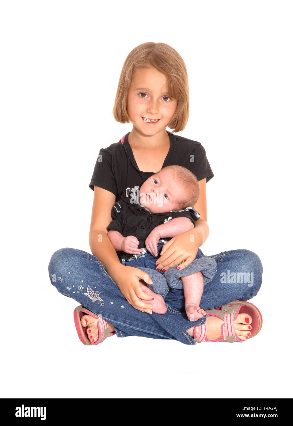 Young girl with three weeks old baby. Stock Photo