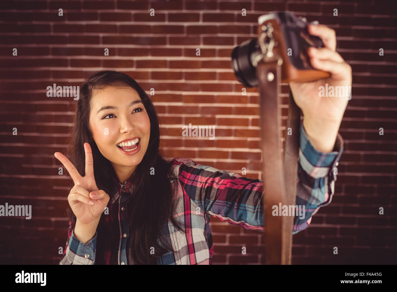 Attractive hipster taking selfie with camera Stock Photo