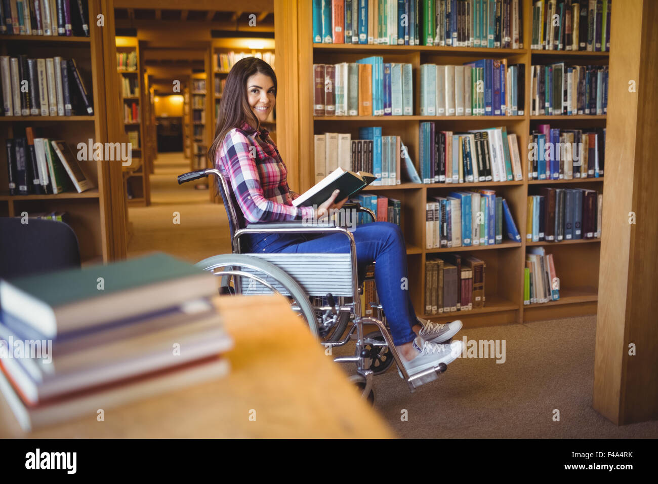 Portrait of disabled female student with book Stock Photo
