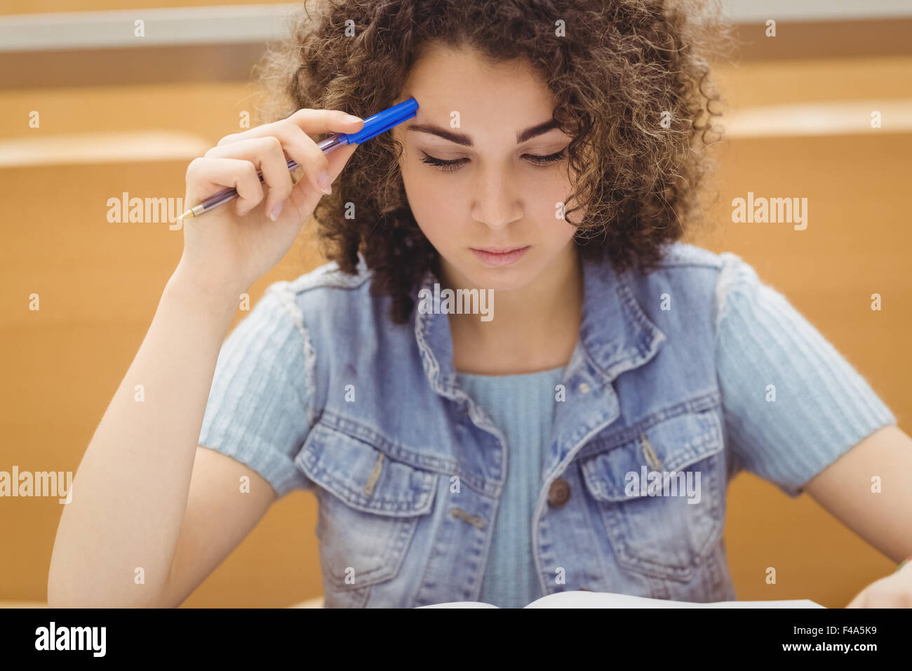 Pretty student in lecture hall Stock Photo