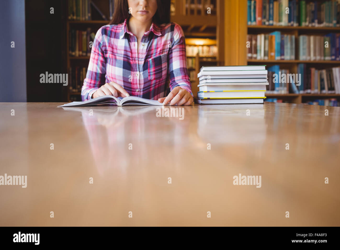 Mid section of female student studying Stock Photo
