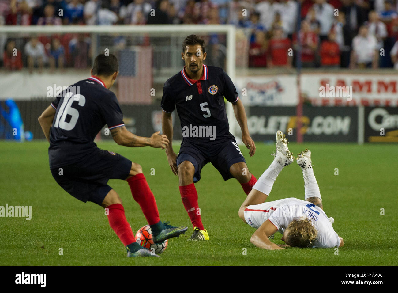 October 13, 2015: USA defender Brek Shea (7) falls down as Costa Rica defender Christian Gamboa (16) and Costa Rica midfielder Celso Borges (5) play the ball during The USA Men's National Team vs. Costa Rica Men's National Team- international friendly at Red Bull Arena - Harrison, NJ. Costa Rica defeated The US Men's National Team 1-0. Mandatory Credit: Kostas Lymperopoulos/Cal Sport Media Stock Photo