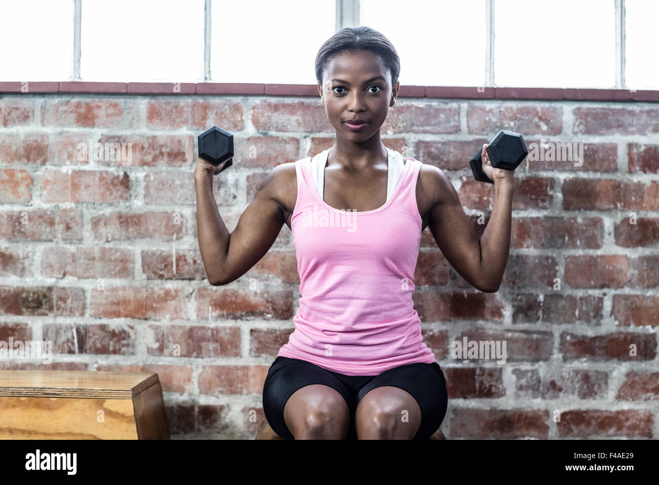 Young pretty concentrated fitness woman hi-res stock photography and ...