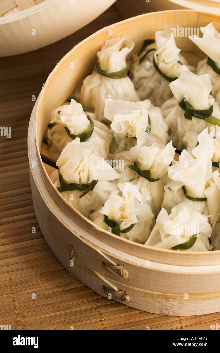 Chinese dumplings in bamboo steamers Stock Photo Alamy