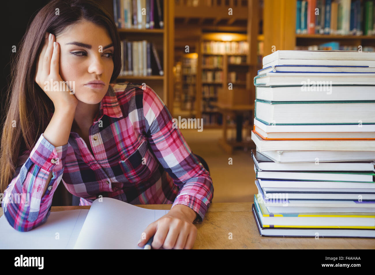 Close-up of thoughtful female student Stock Photo