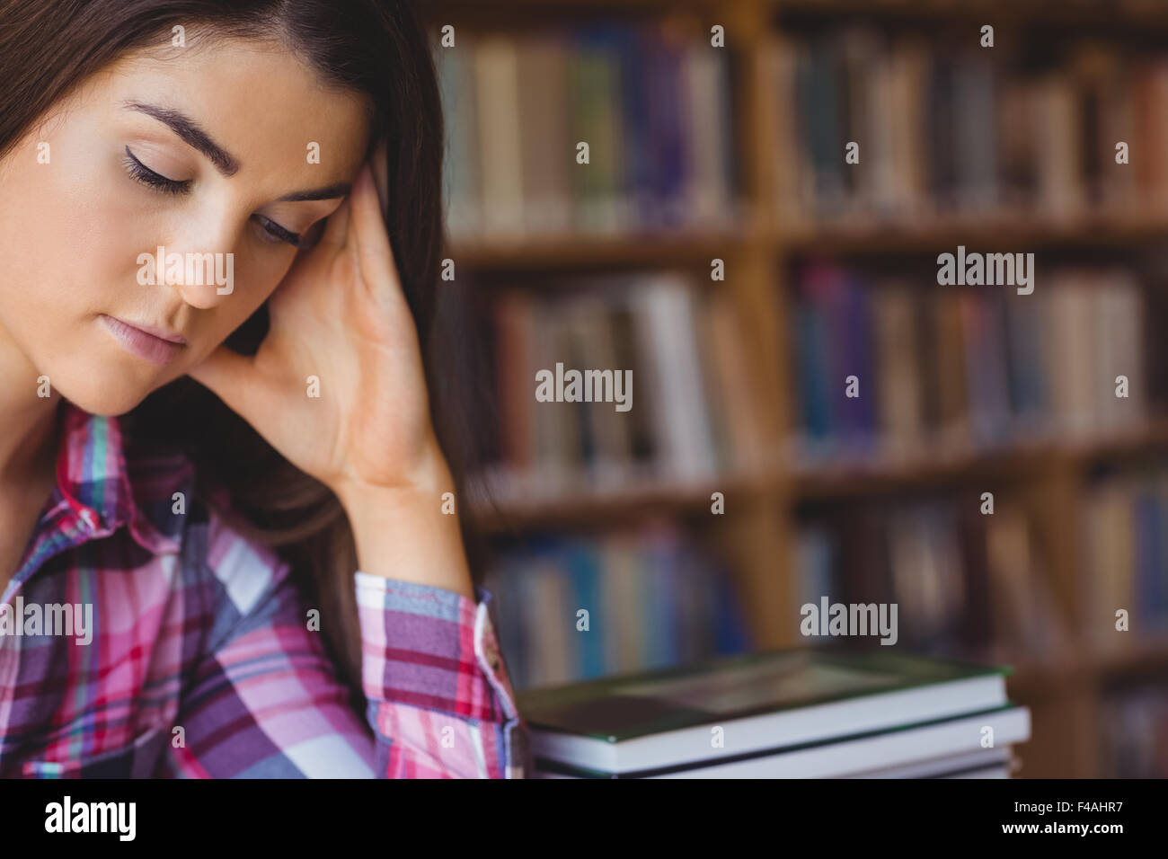 Concentrated female student studying Stock Photo
