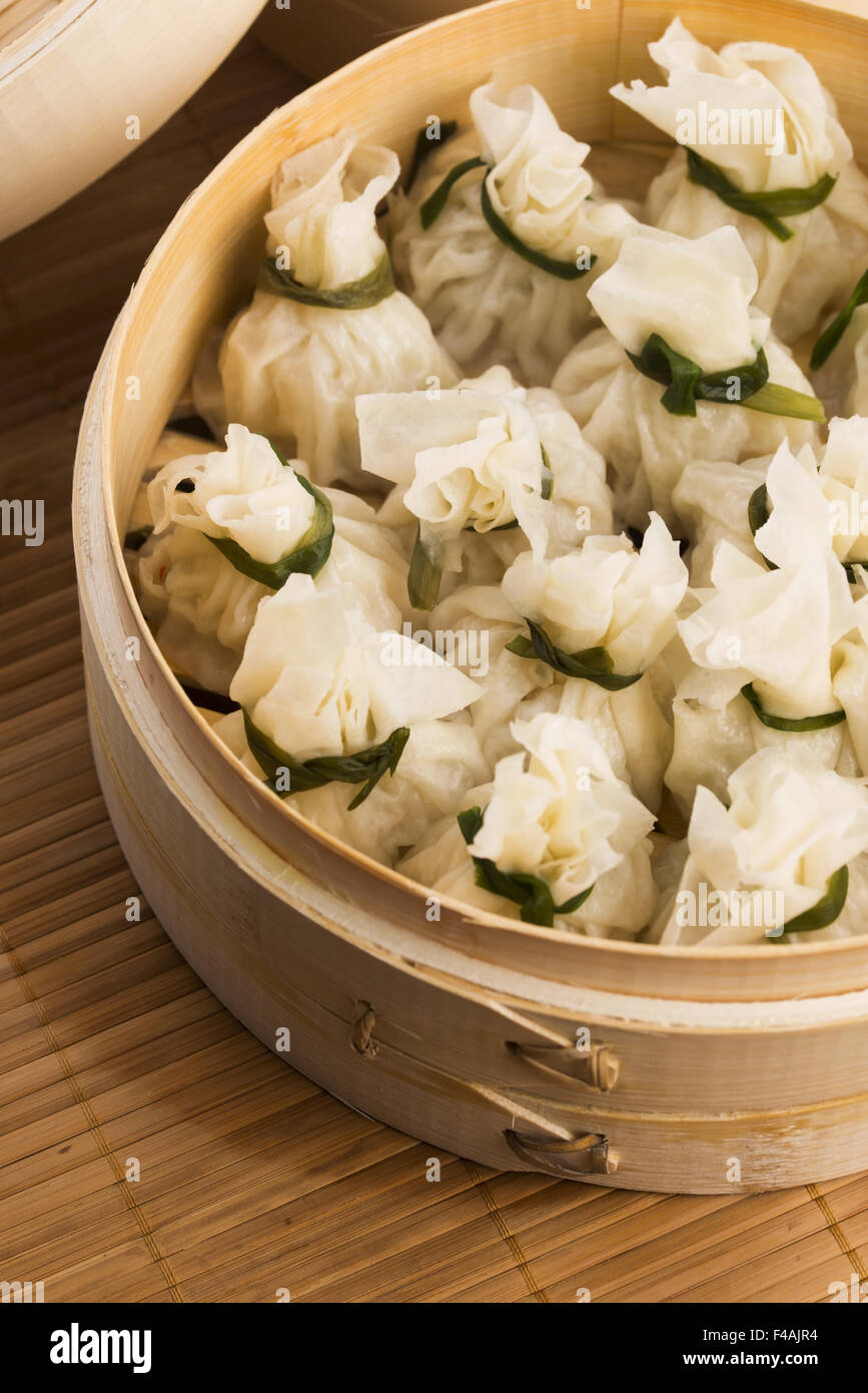 Chinese dumplings in bamboo steamers Stock Photo Alamy