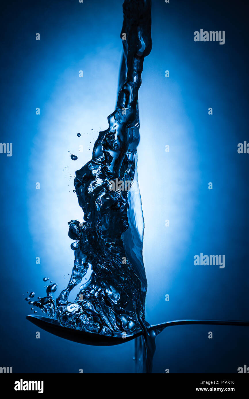 spoon in water Stock Photo - Alamy