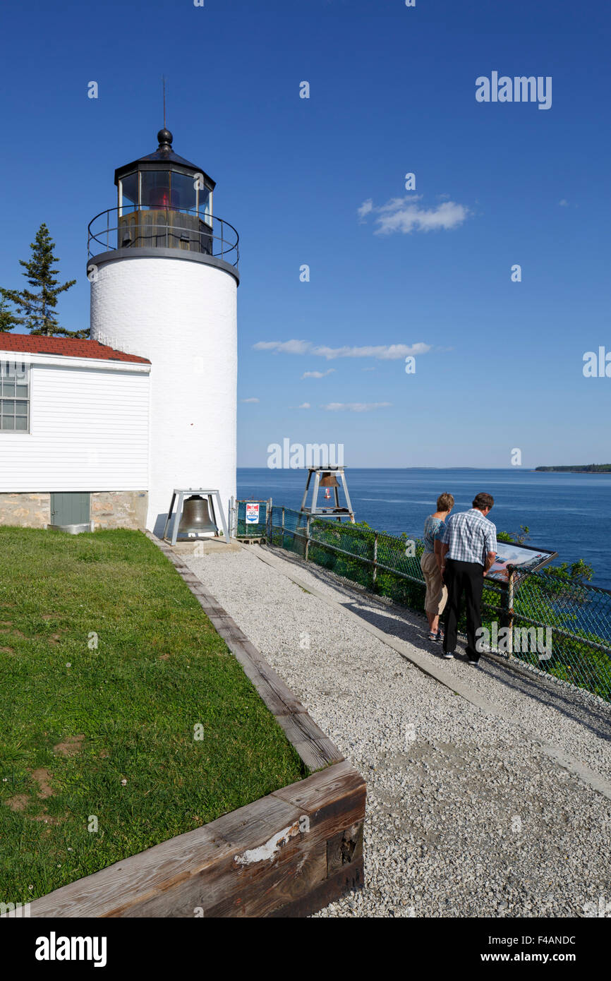 Bass Harbor Head Lighthouse, in Acadia National Park, Maine USA  two people information board on adjacent  walkway Stock Photo