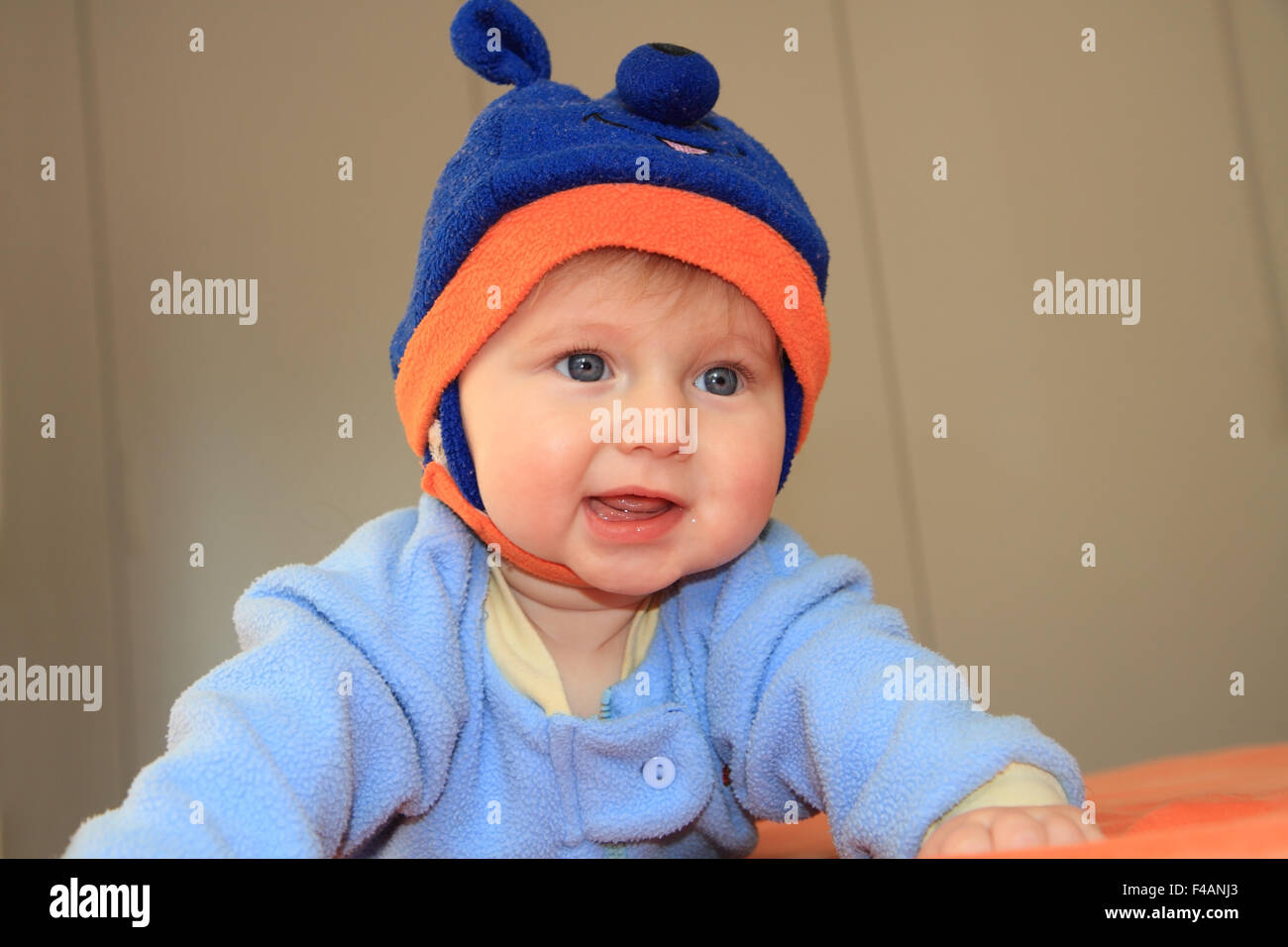 Charming baby trying to crawl Stock Photo