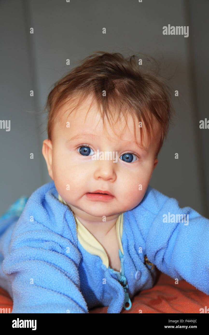 Charming blonde baby with blue eyes Stock Photo