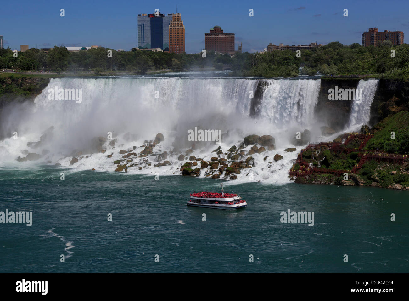 Hornblower tour boat at the base of the American Falls on the Niagara River Niagara Falls New York seen from Canada Stock Photo