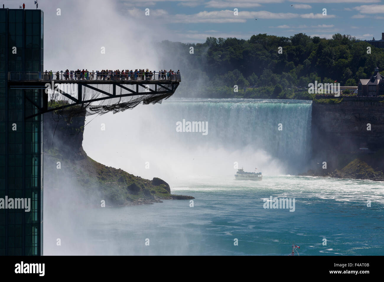 Tourists on the observation tower at Niagara Falls silhouetted by the mist of Horseshoe Falls Stock Photo
