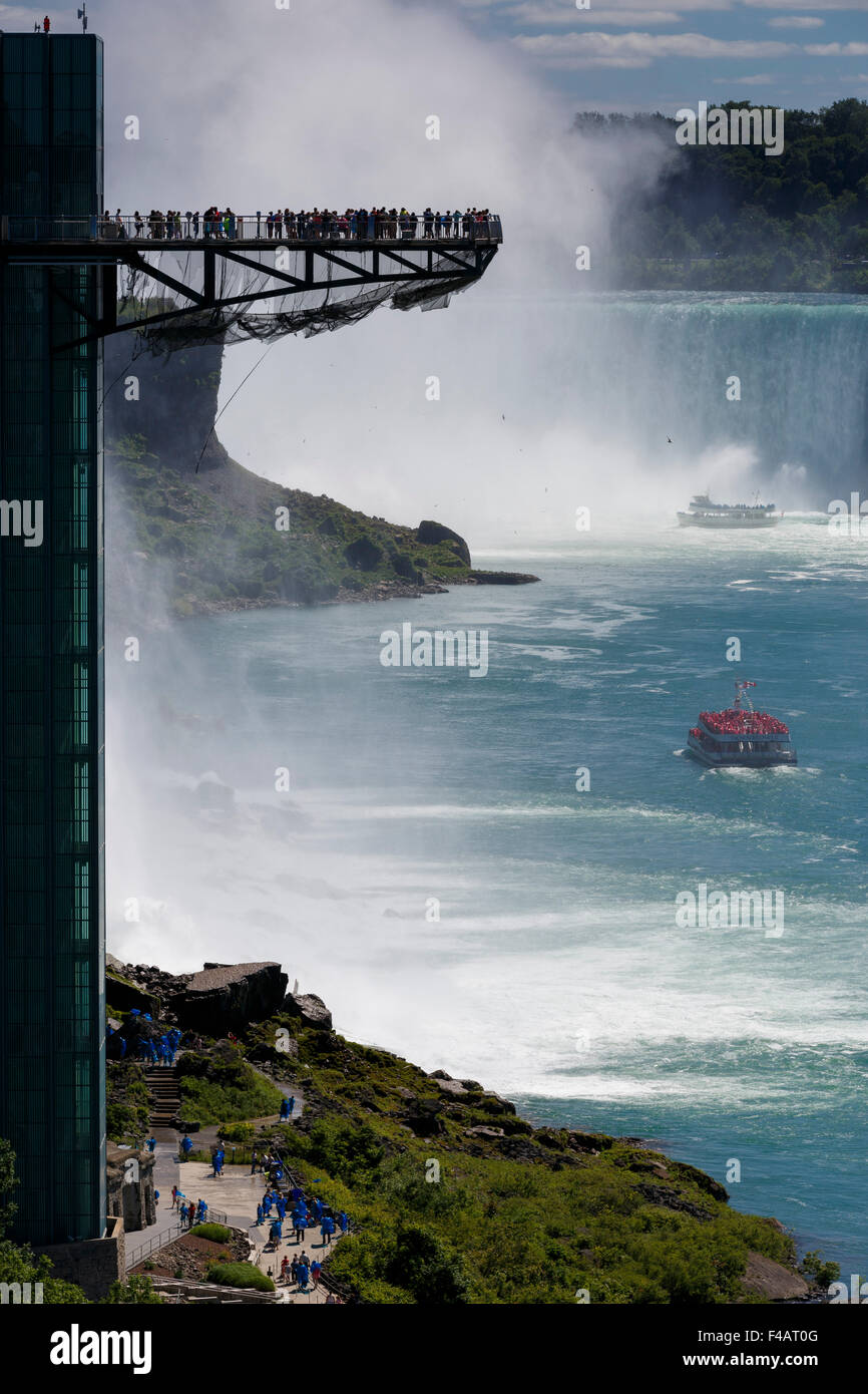 Tourists on the observation tower at Niagara Falls silhouetted by the mist of Horseshoe Falls Stock Photo