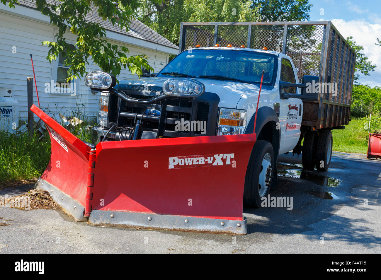 Ford pickup truck with snow plow attached Stock Photo Alamy