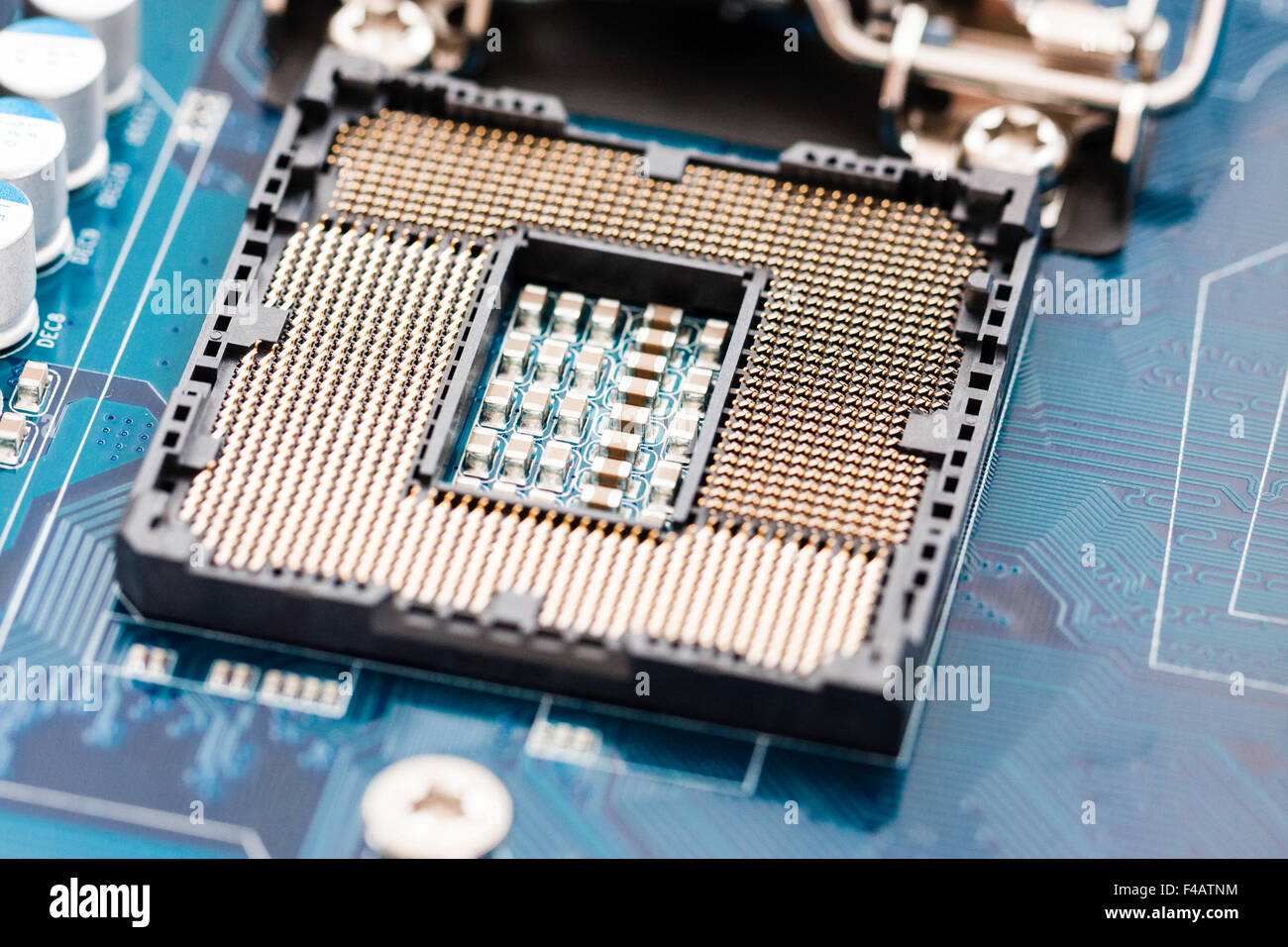 Motherboard of computer, with an empty Intel 1156 socket processor base,  open showing the processor pin array before the processor is fitted Stock  Photo - Alamy