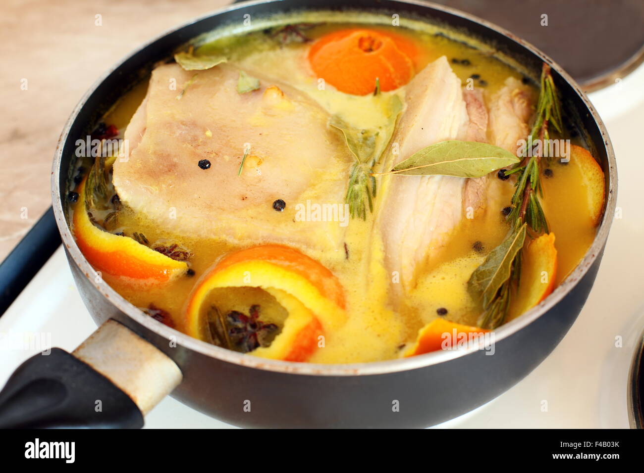 Pork loin in orange juice with spices Stock Photo Alamy