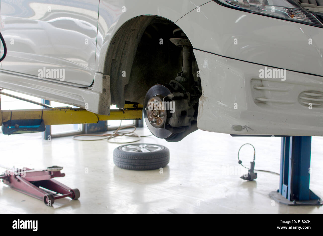 Inside a garage changing wheels/tires Stock Photo Alamy