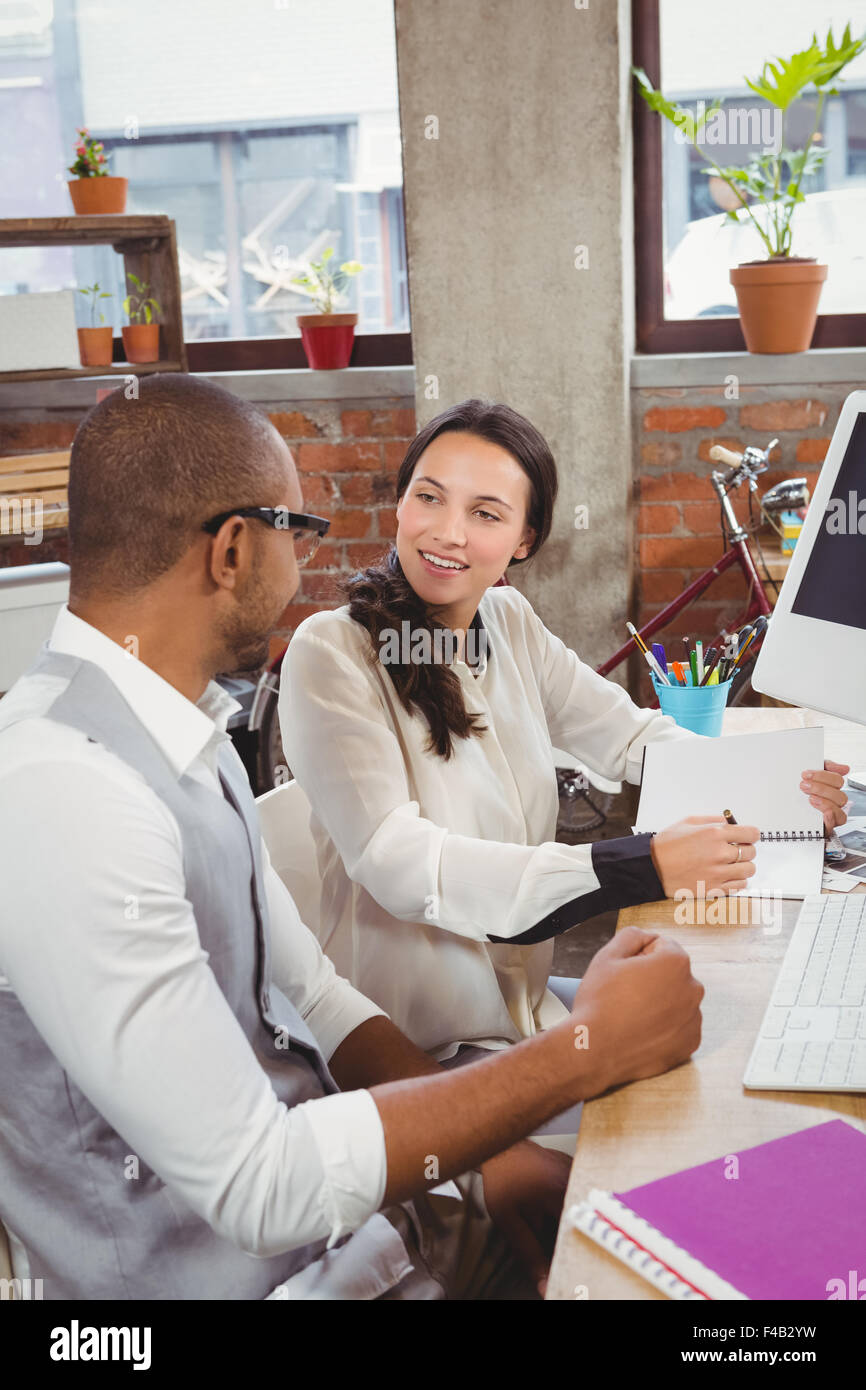 Man and woman communicating at office Stock Photo