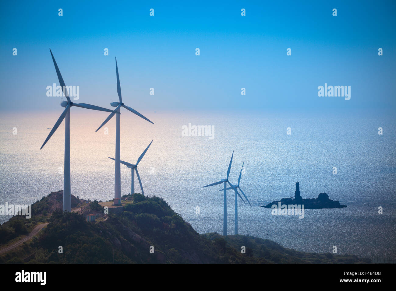 wind turbines generating electricity at the beach Stock Photo
