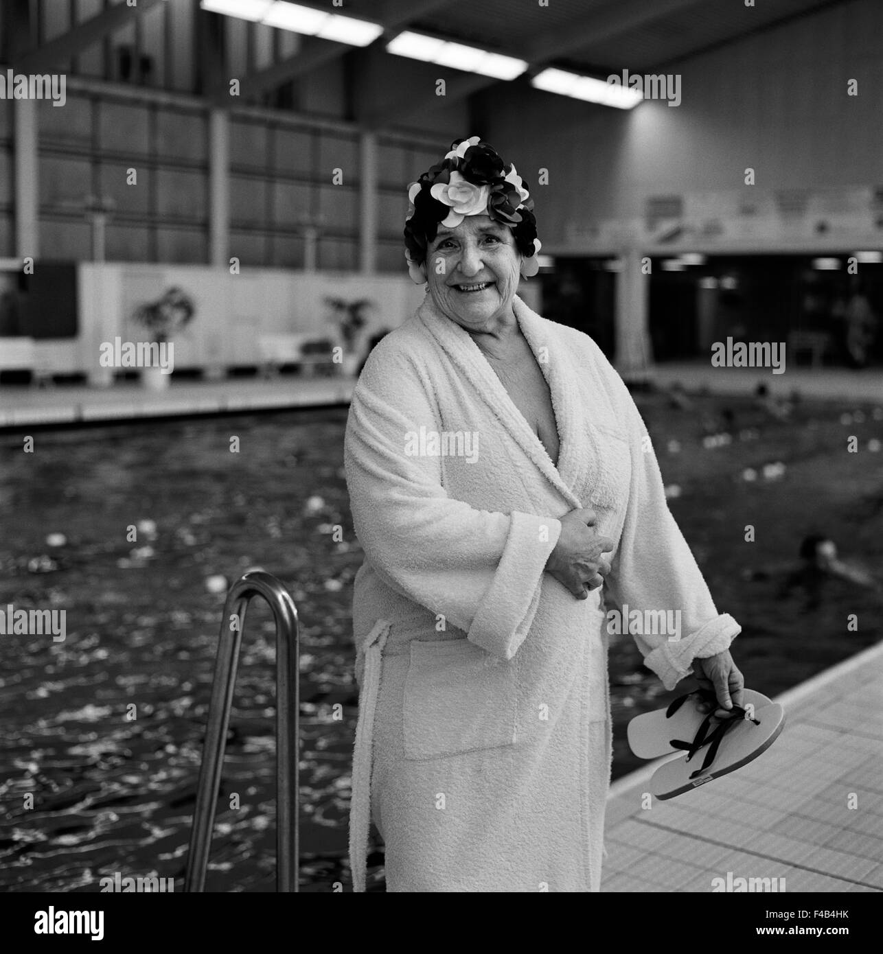 Old woman in bathrobe in a public baths Stock Photo Alamy