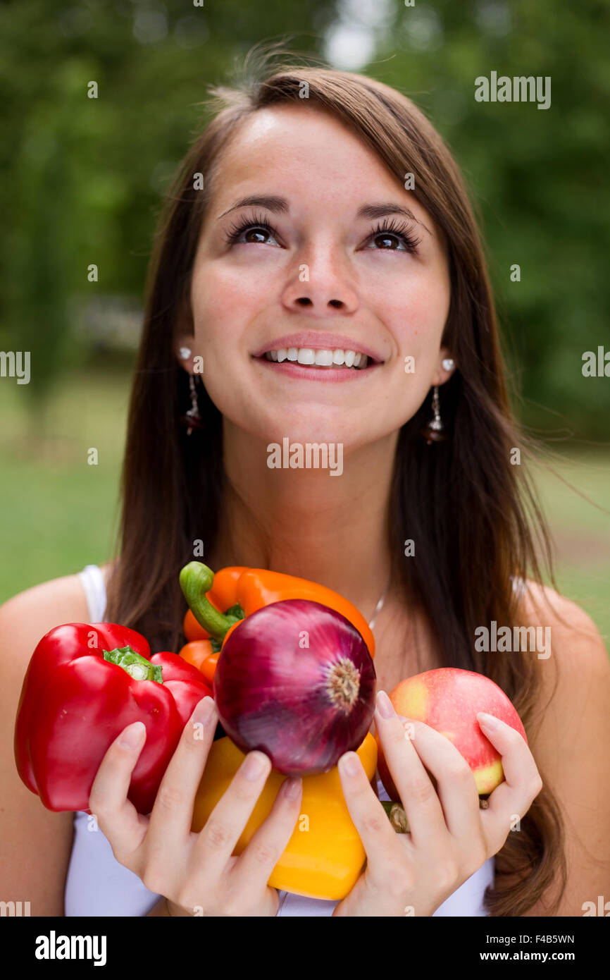 young happy woman holding healthy food Stock Photo - Alamy
