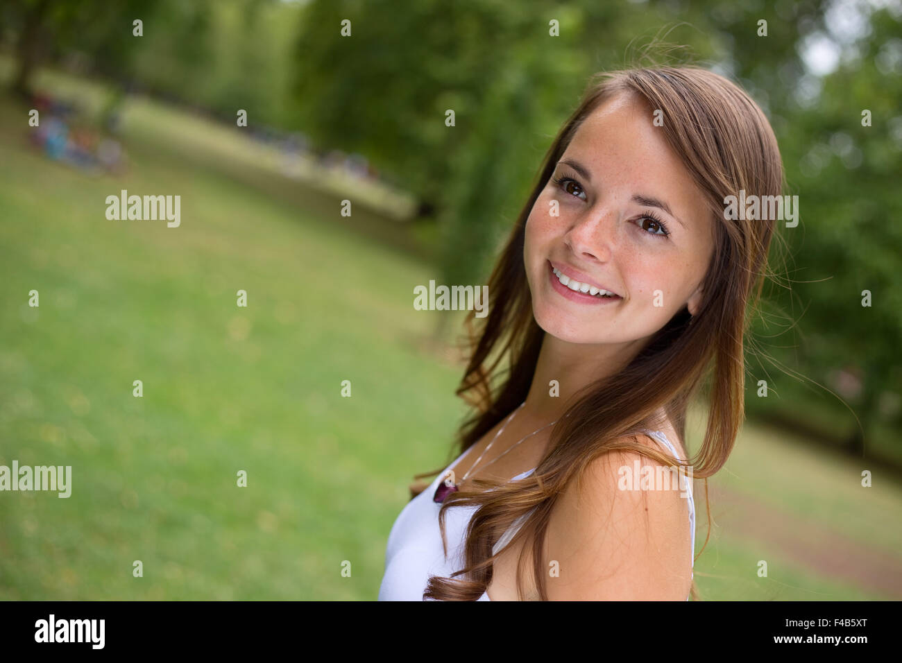 portrait of a young woman in the park Stock Photo - Alamy