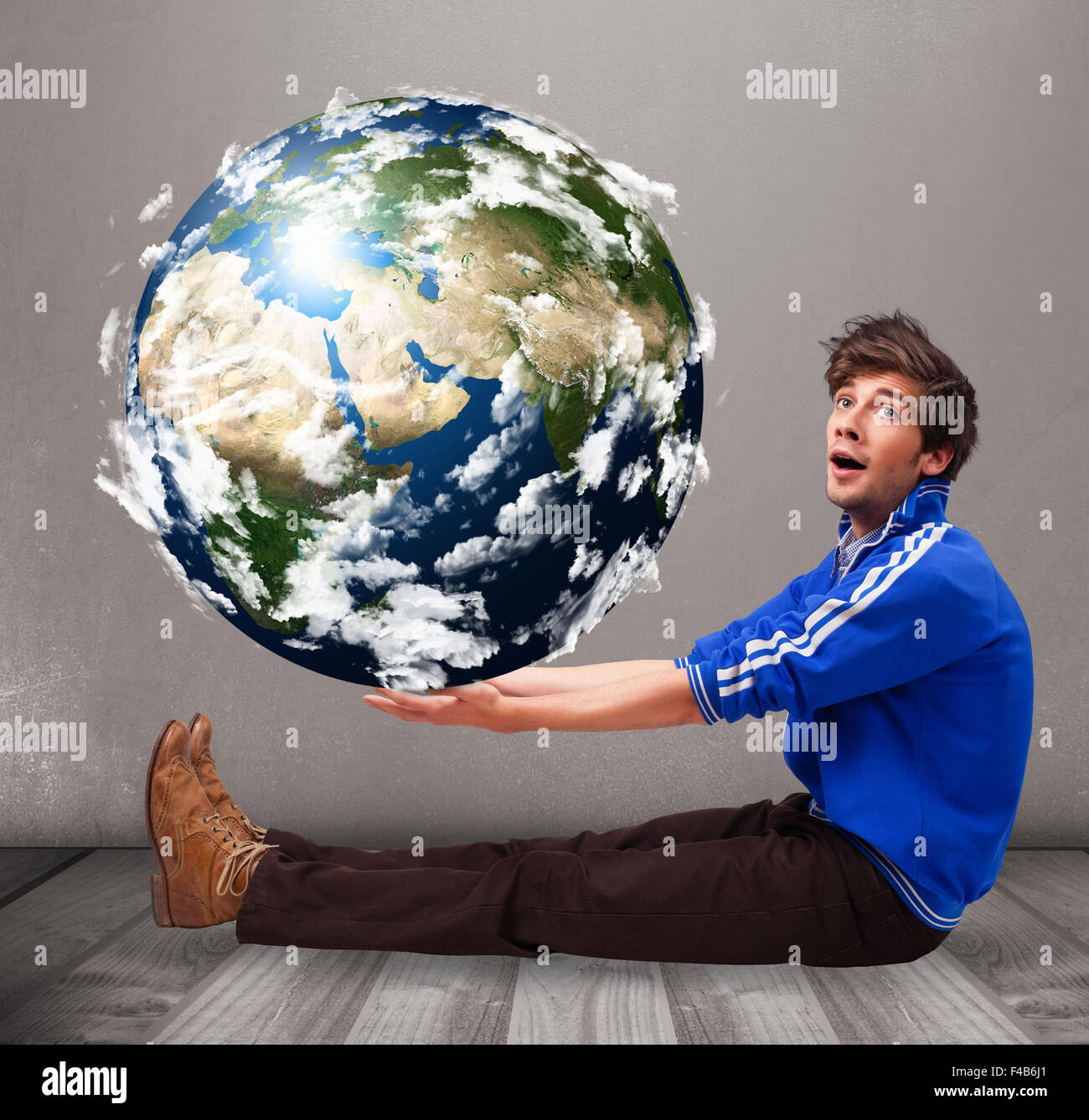 Good-looking man holding 3d planet earth Stock Photo - Alamy