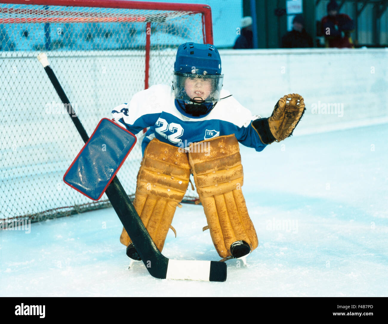 activity boys catalogue 2 children only color image elementary age goal goalkeeper helmet horizontal ice hockey stick Stock Photo