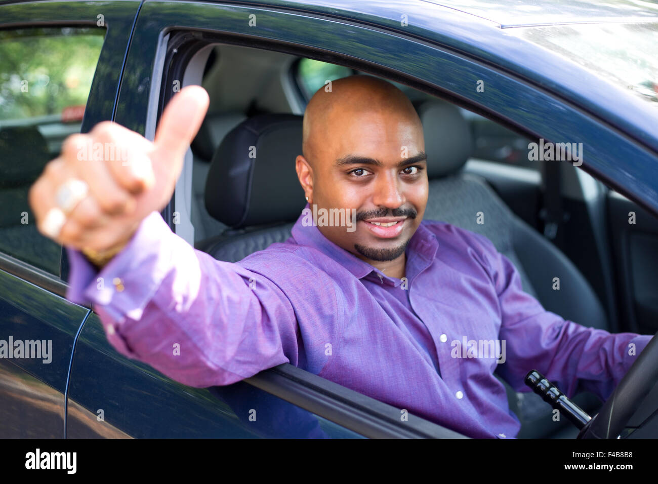 driver showing the thumbs up signal Stock Photo