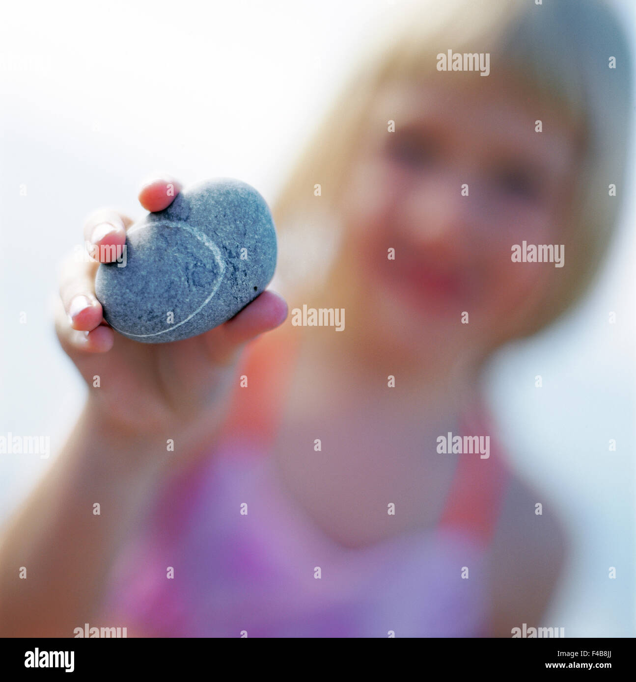 Girl keeps in stone Stock Photo Alamy