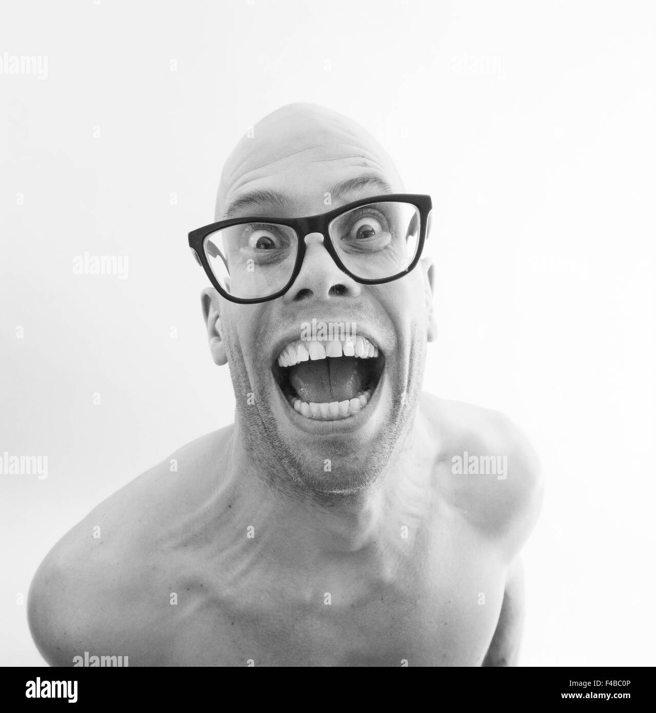 30-34 years adults only bald headed black and white body language catalogue 2 conceptual effort emotional series expression Stock Photo