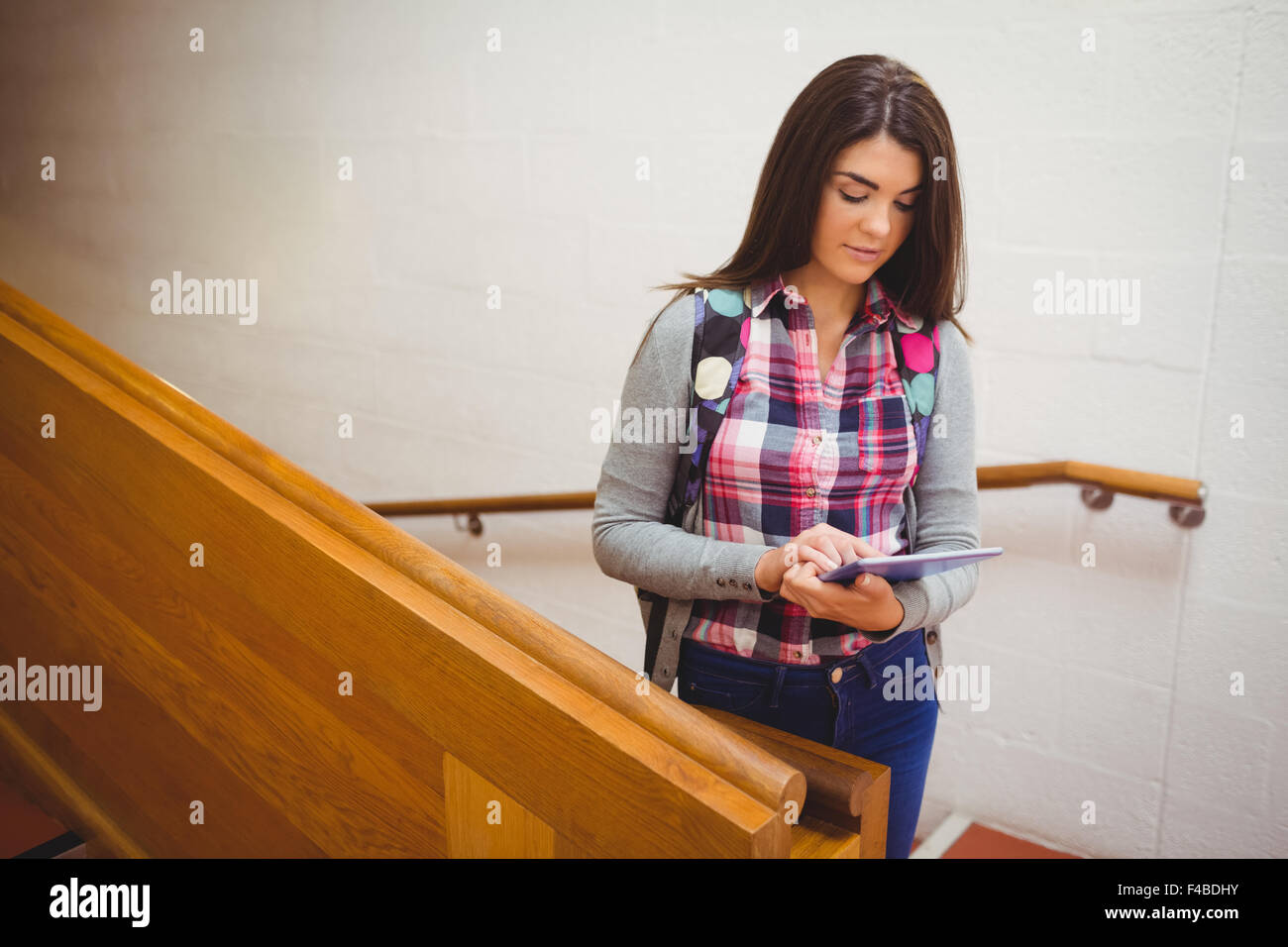 Female student using digital tablet Stock Photo