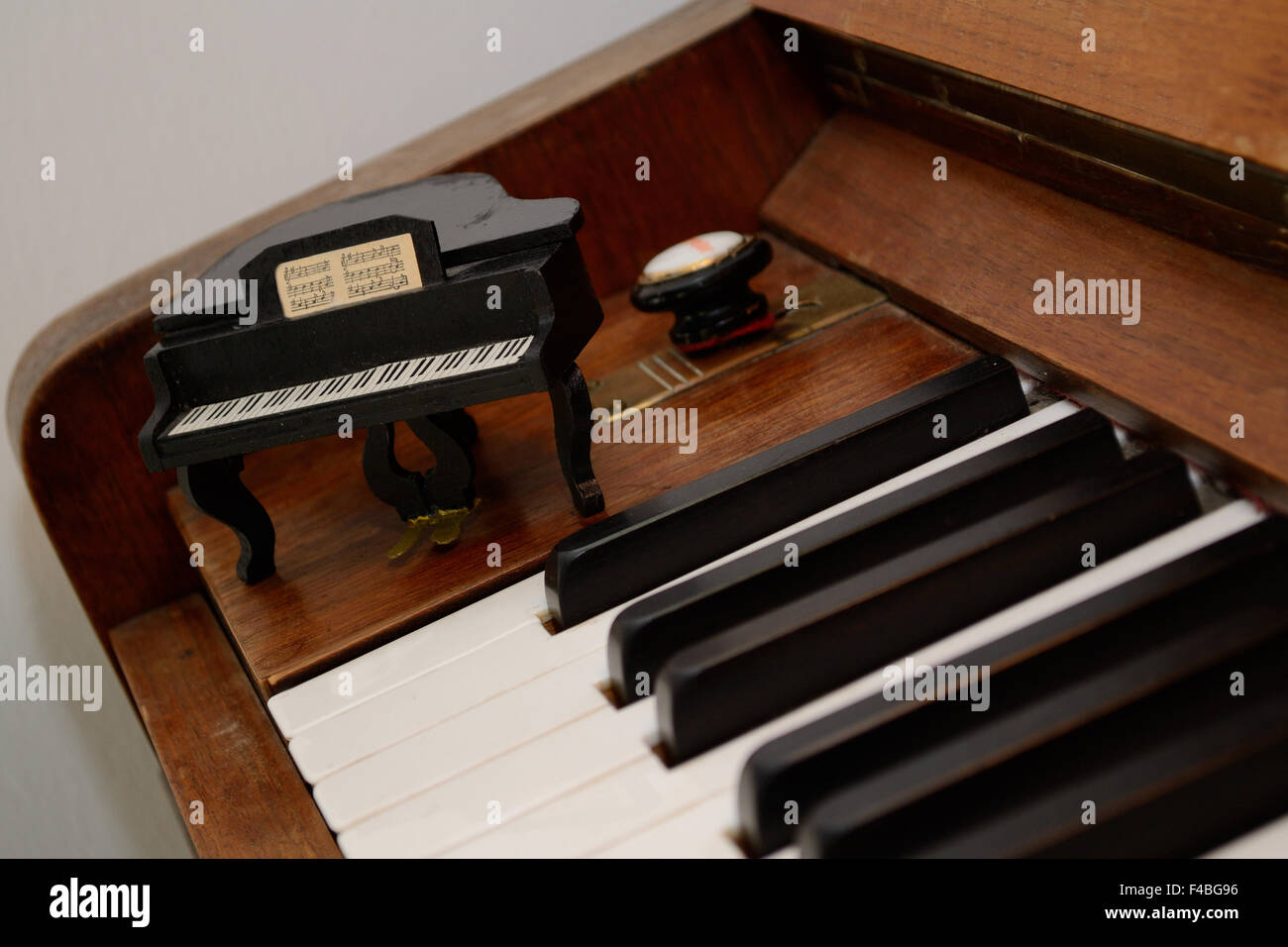 Mini piano at the big piano Stock Photo