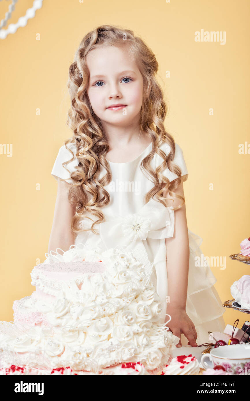 Premium Photo | Children's birthday. happy little girl poses in front of  the camera, smiling child shows tongue.