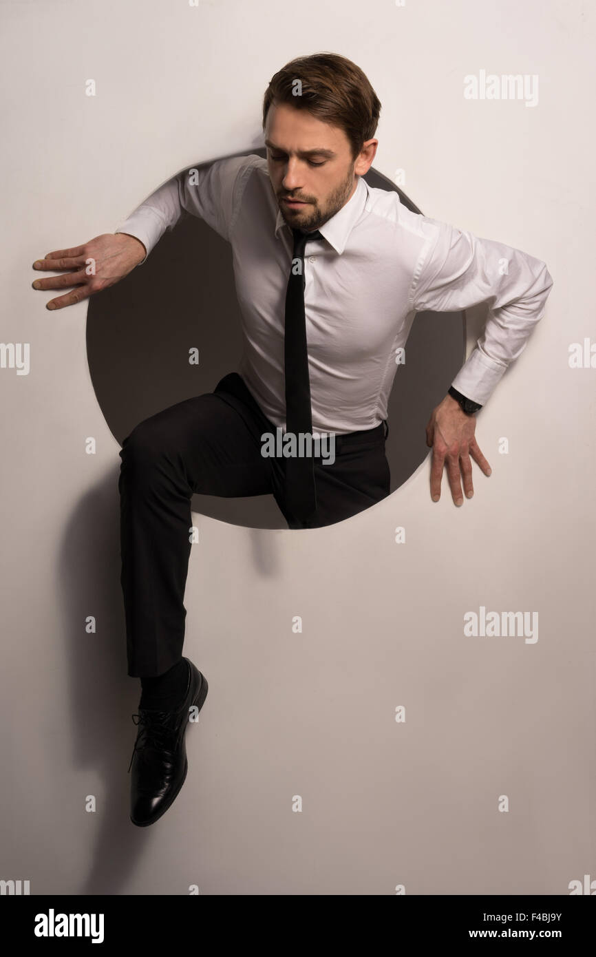 Climbing out of hole hires stock photography and images Alamy