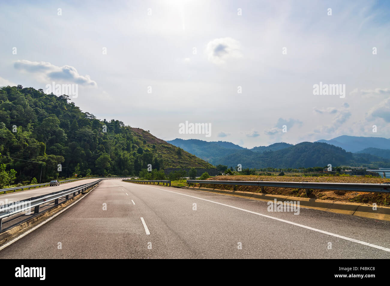 Bridge and asphalt road with blue skies Stock Photo - Alamy