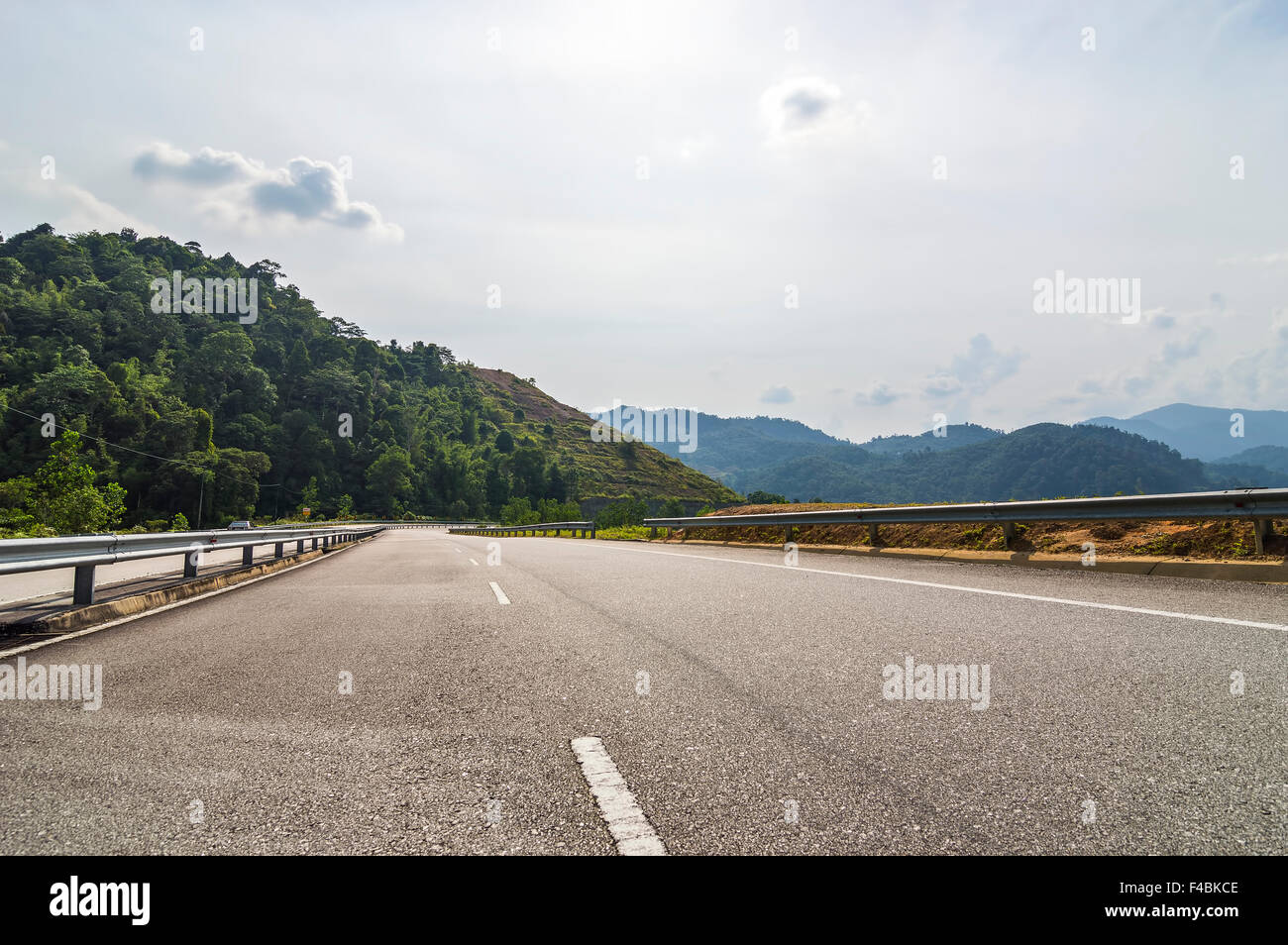 Bridge and asphalt road with blue skies Stock Photo - Alamy