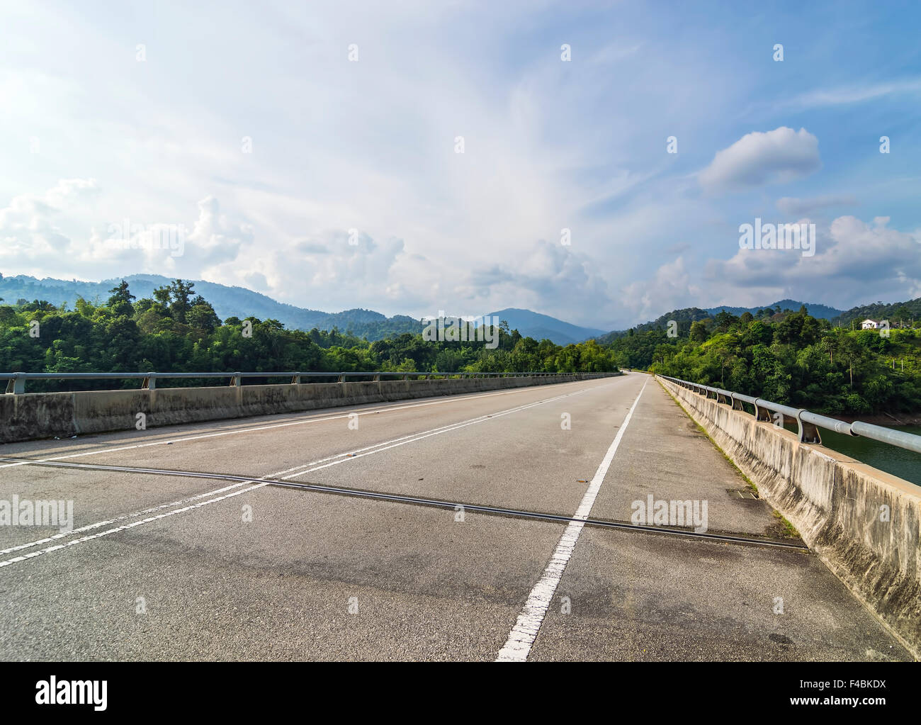 Bridge and asphalt road with blue skies Stock Photo - Alamy