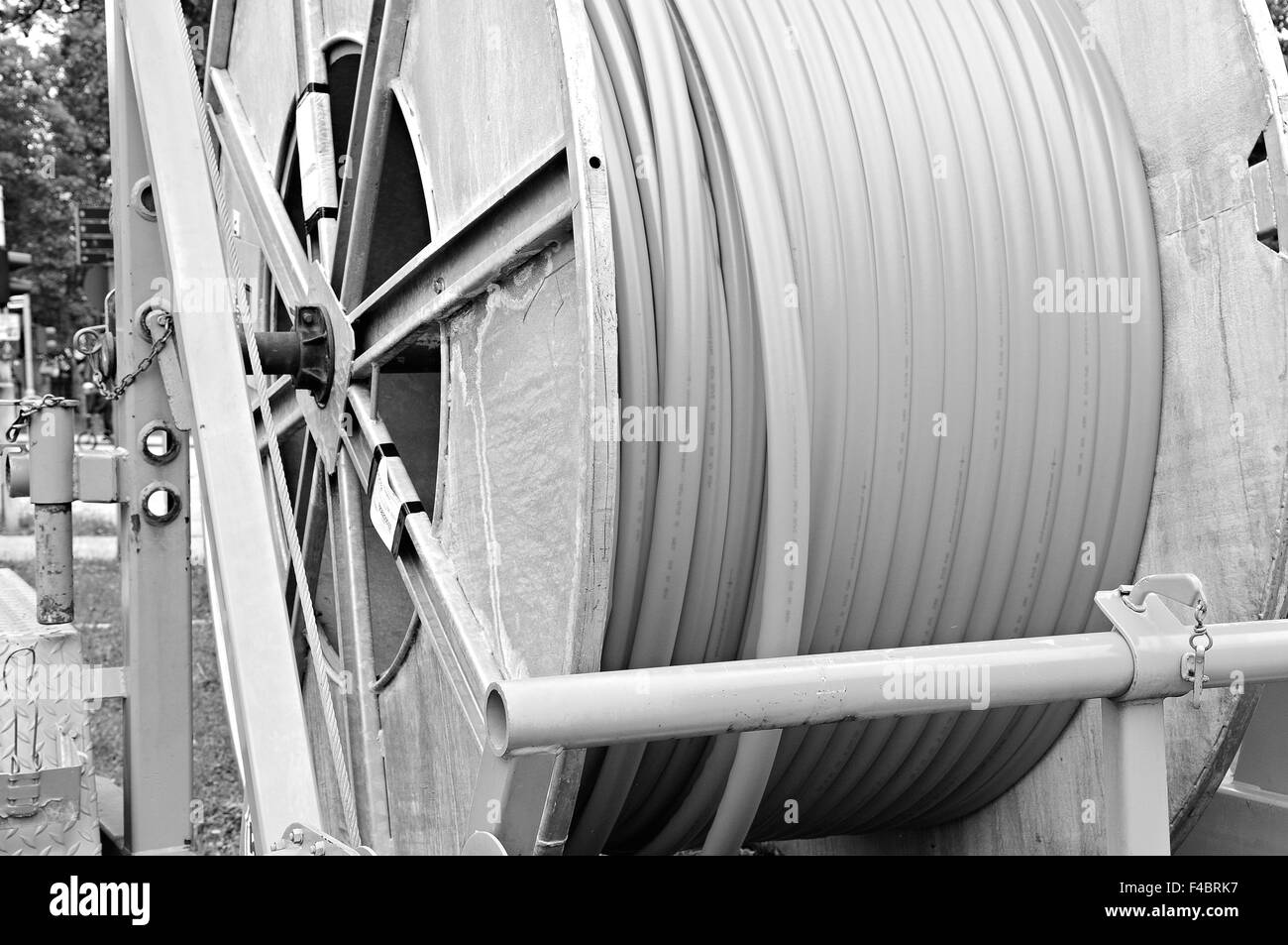 Broadband cable drum with laying trailer Stock Photo