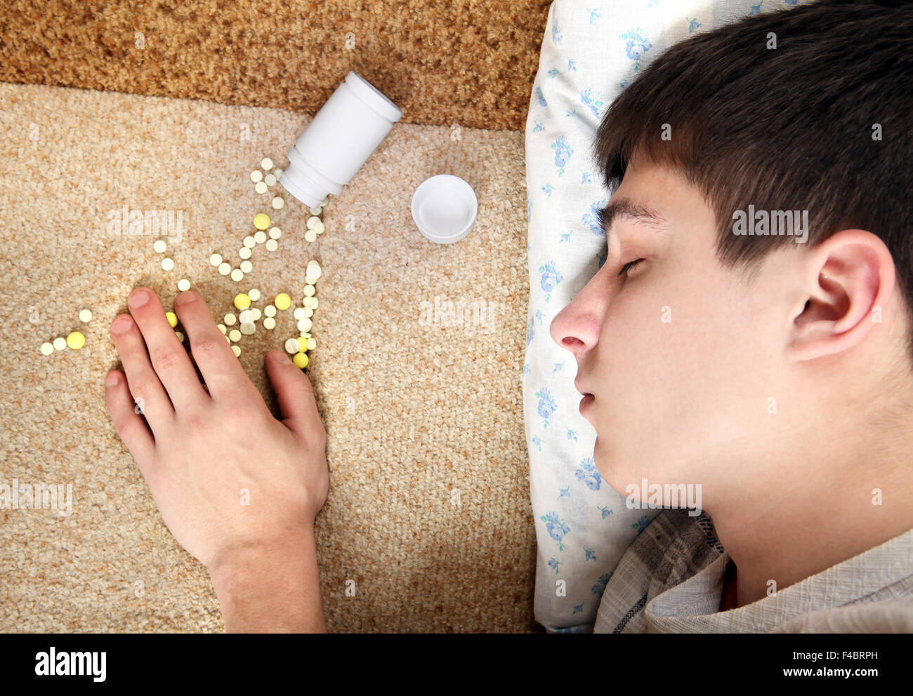 Teenager sleeps near the Pills Stock Photo