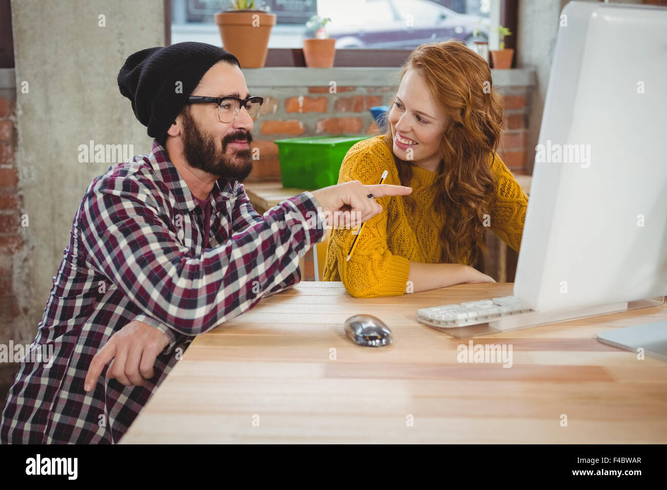 Man pointing and woman looking at him Stock Photo - Alamy