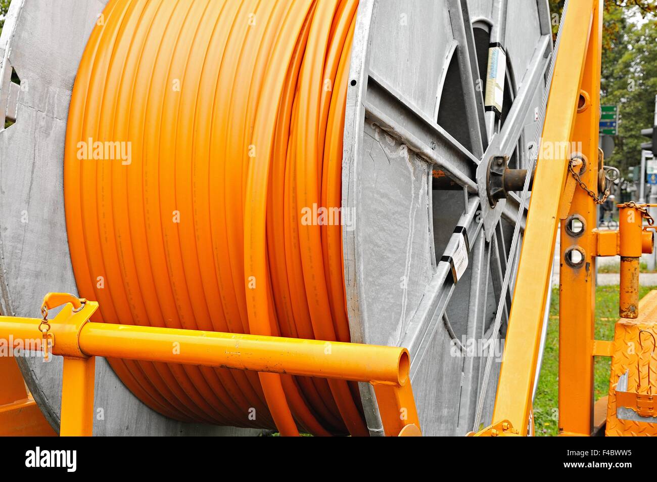Laying trailer with broadband cable drum Stock Photo