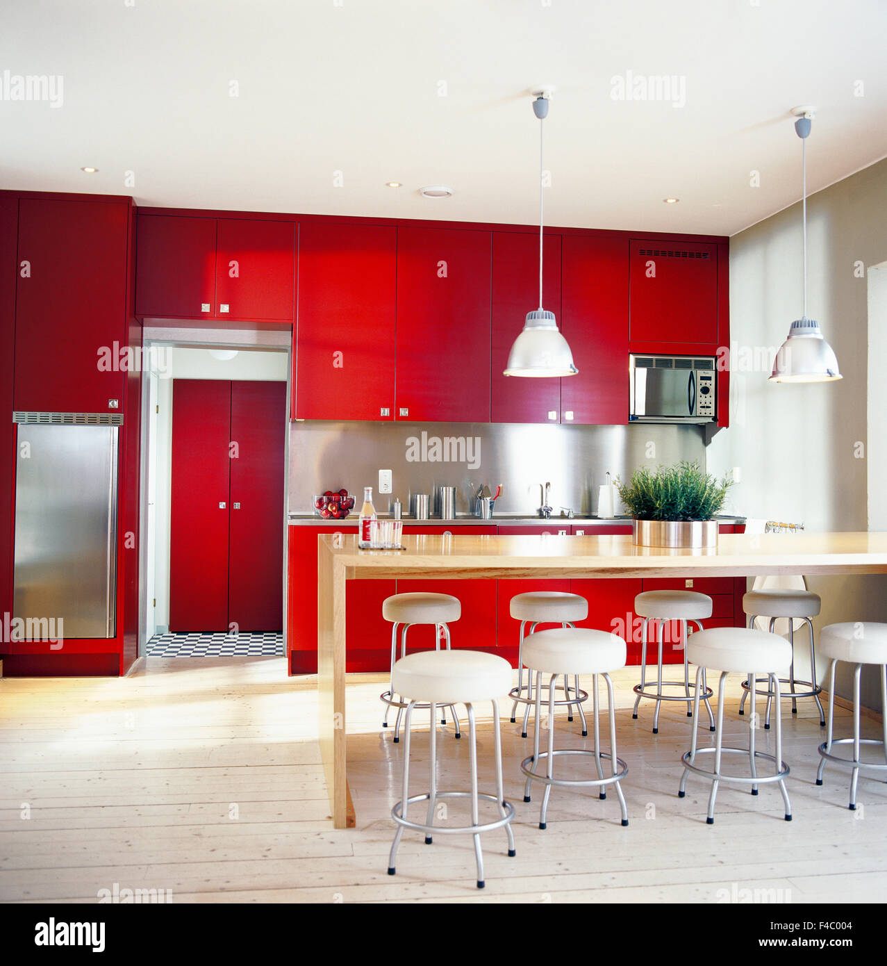 A kitchen with red cupboards Stock Photo Alamy
