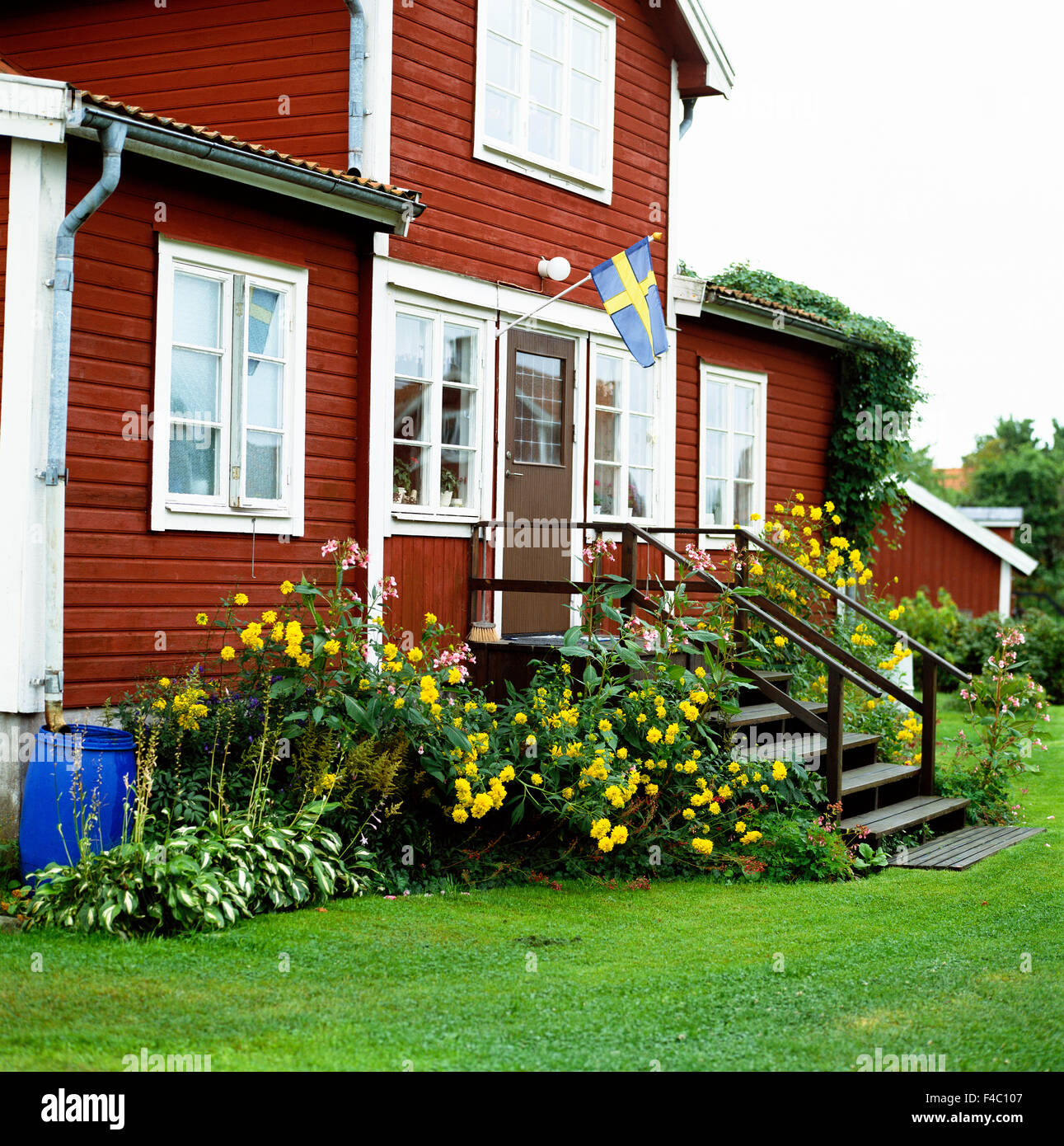 A red house and the Swedish flag. Stock Photo