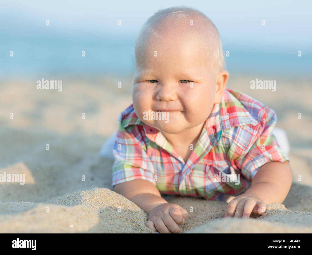 Baby on the beach Stock Photo - Alamy