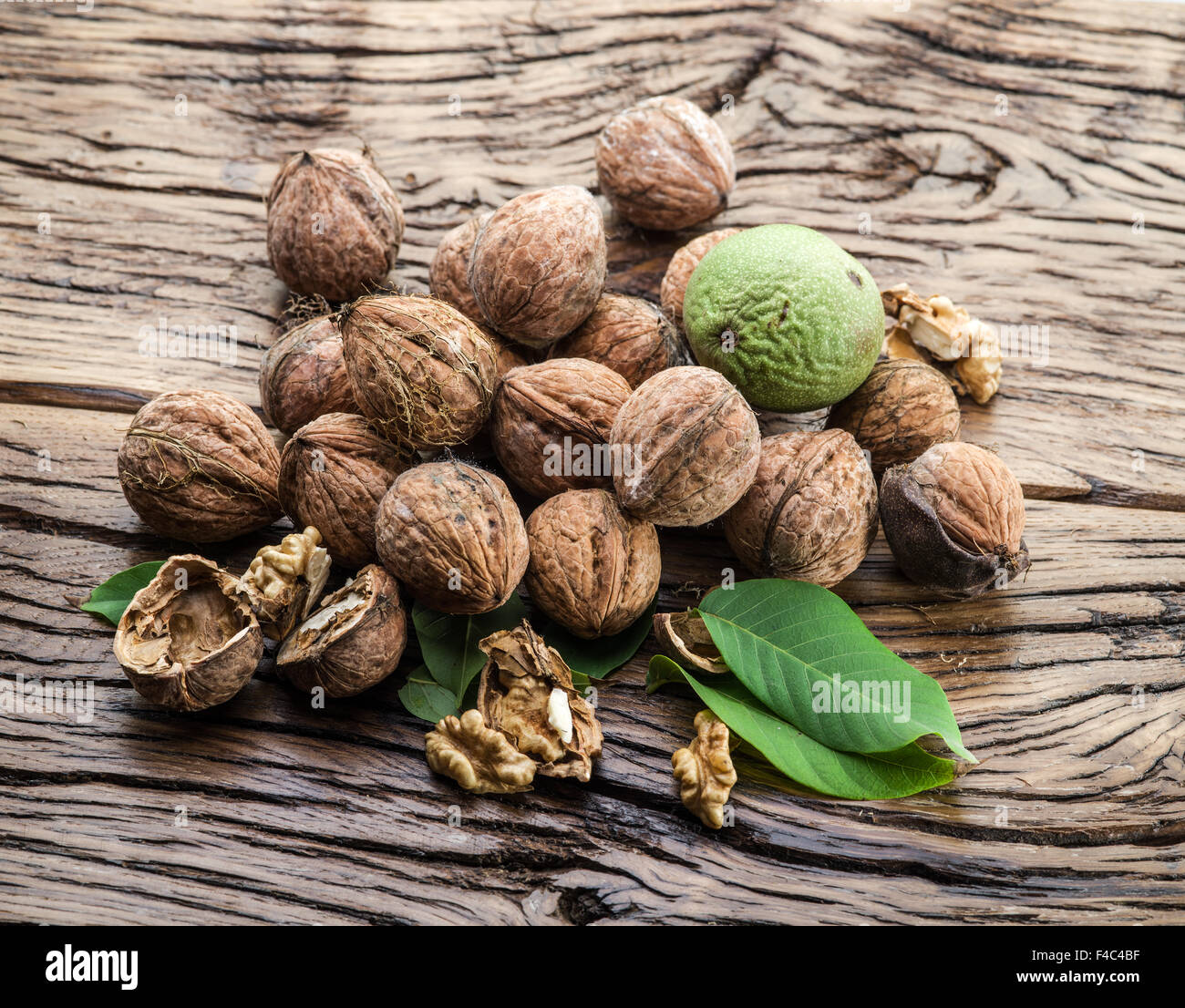 Walnuts in the wooden table. The autumn harvest. Stock Photo