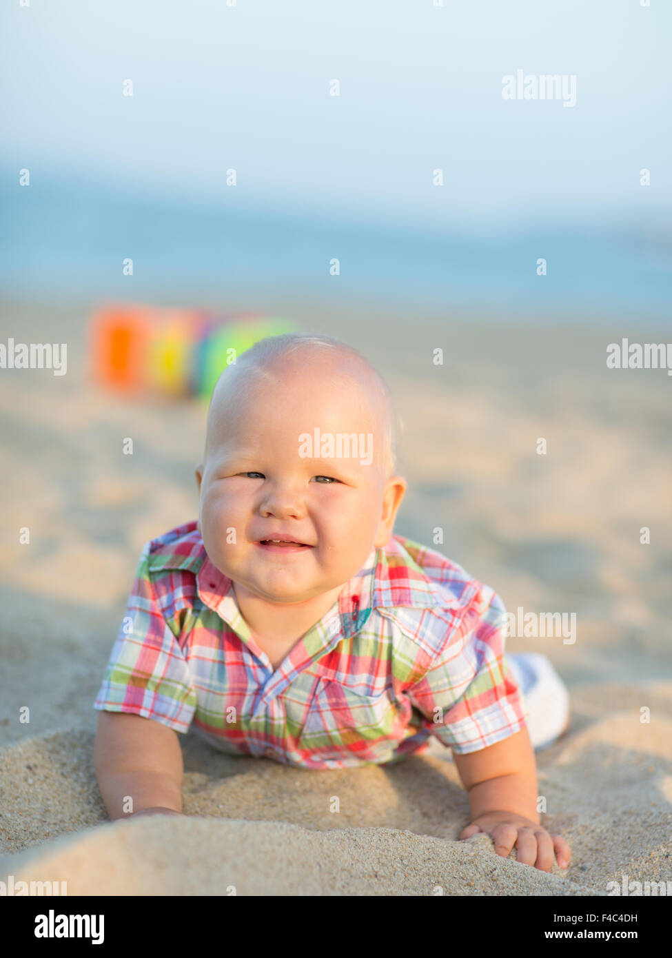 Baby on the beach Stock Photo - Alamy