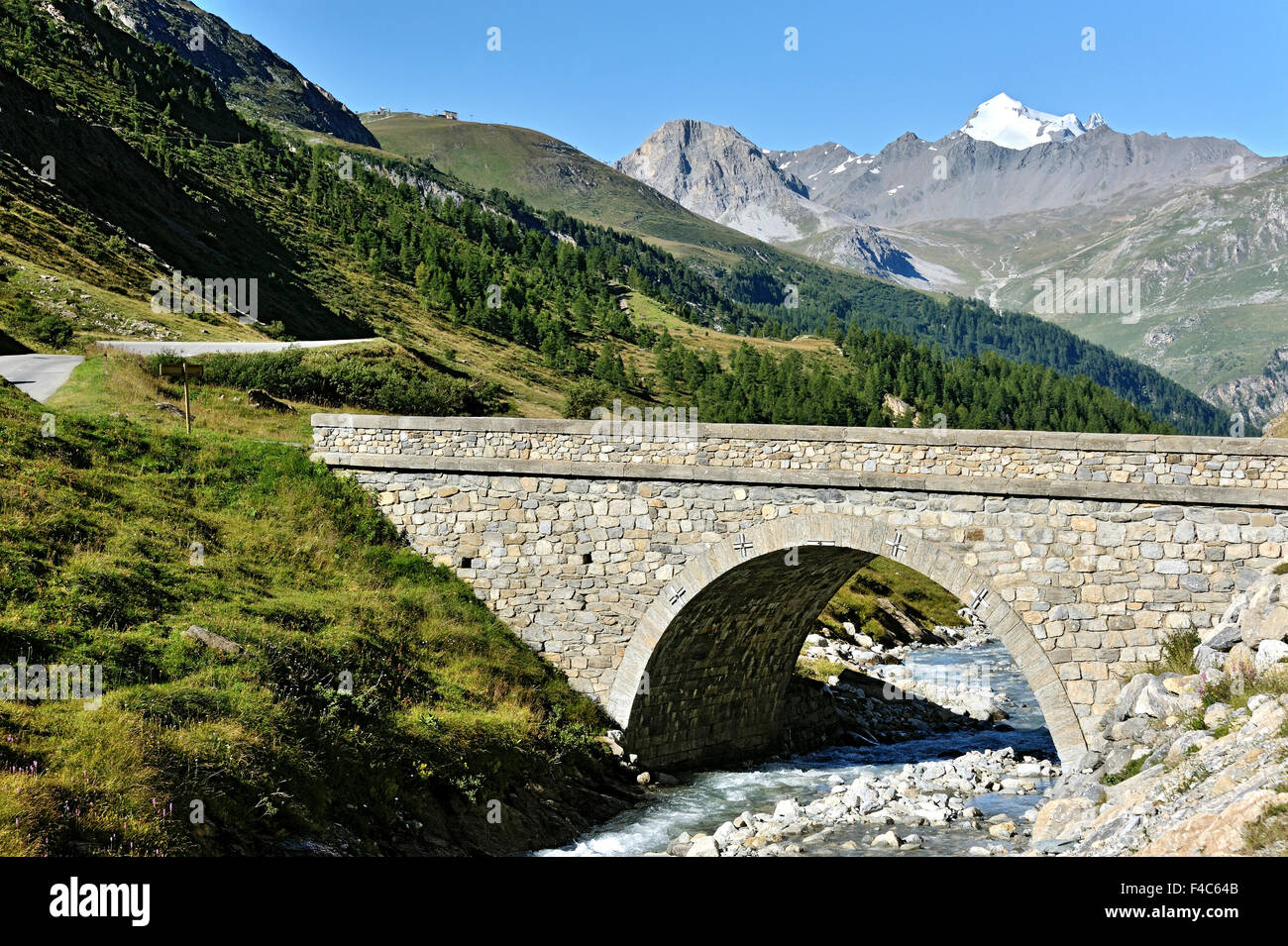 Valley Val-D'Isère the bridge St. Charles , Route des Grandes Alpes,  French Alps, France, view to La Grande Motte Stock Photo